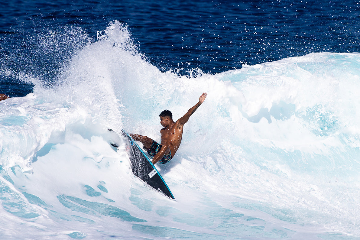 A surfer riding the wave