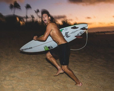 Crosby playing with camera at beach