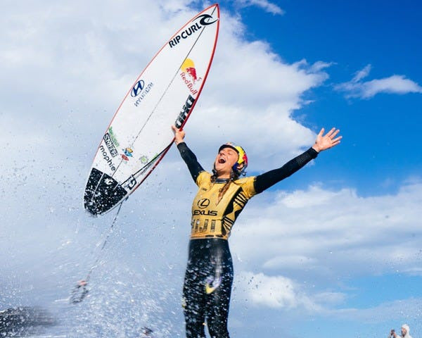 Woman with happy face winning surf competition