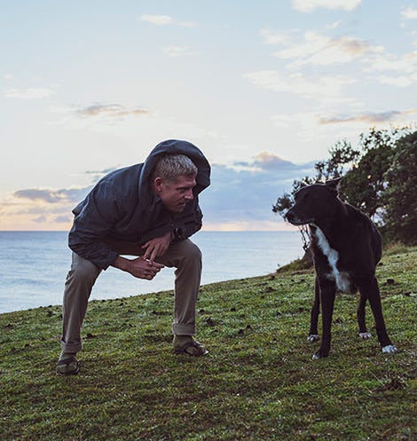 Mick Fanning playing with his dog