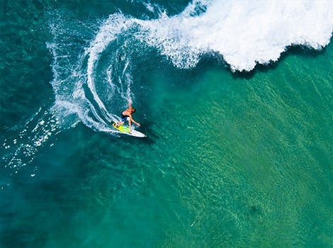 Top view of a surfer in water